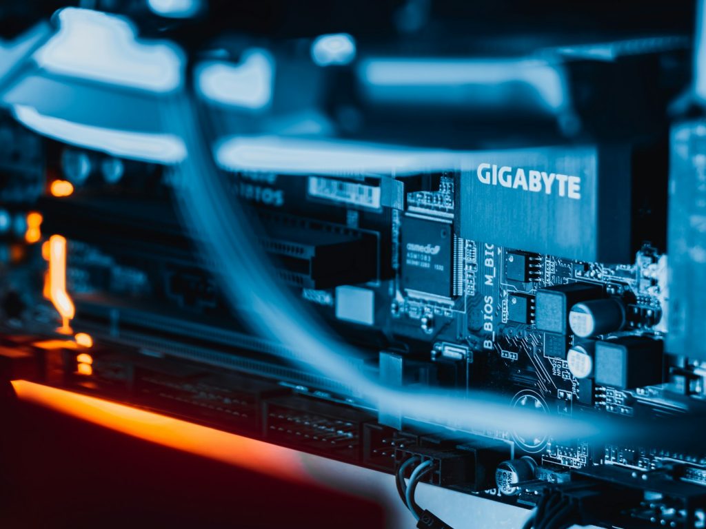 a close up of a computer motherboard with wires
